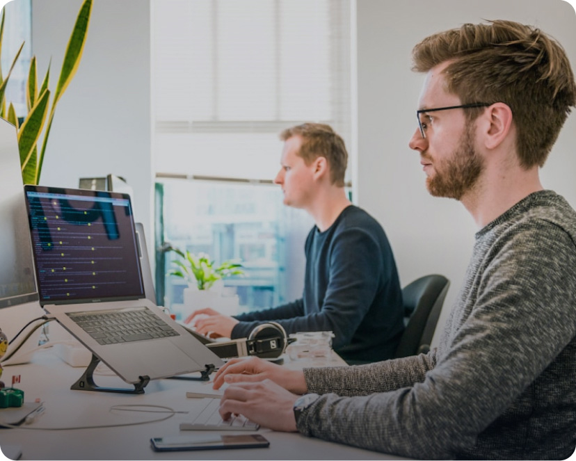 Employee working at laptop with AI tools
